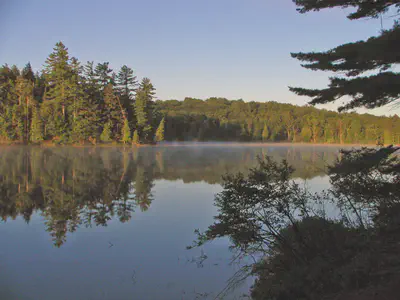 Long Pond Lake at Adirondacks Region. By Original uploader was Mwanner
at en.wikipediaLater version(s) were uploaded by XcepticZP at
en.wikipedia. - Transferred from en.wikipedia, CC BY-SA 3.0,
https://commons.wikimedia.org/w/index.php?curid=4044745